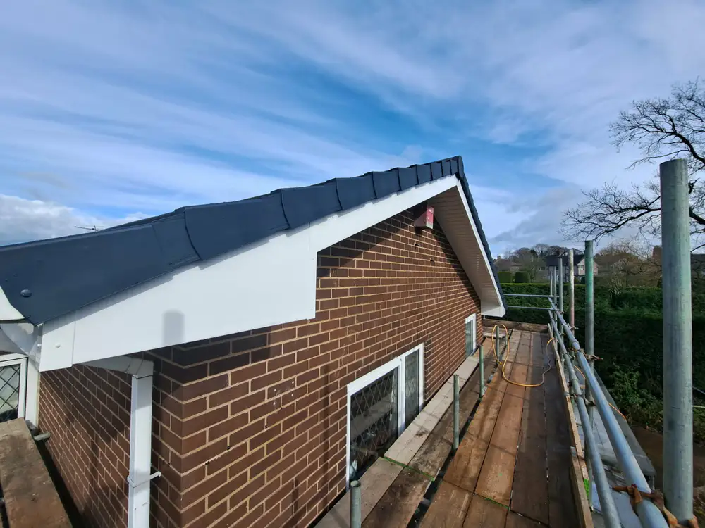 Roofline of a house with scaffolding during roofing work