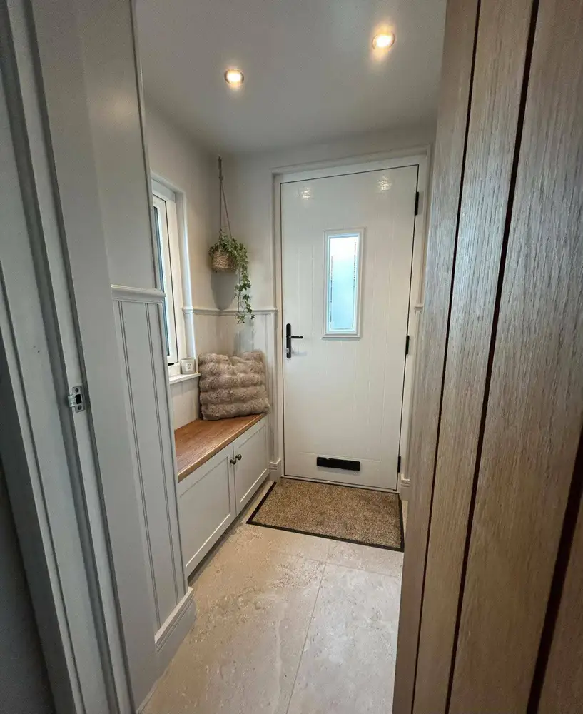 Bright finished entrance hall with built-in bench and storage